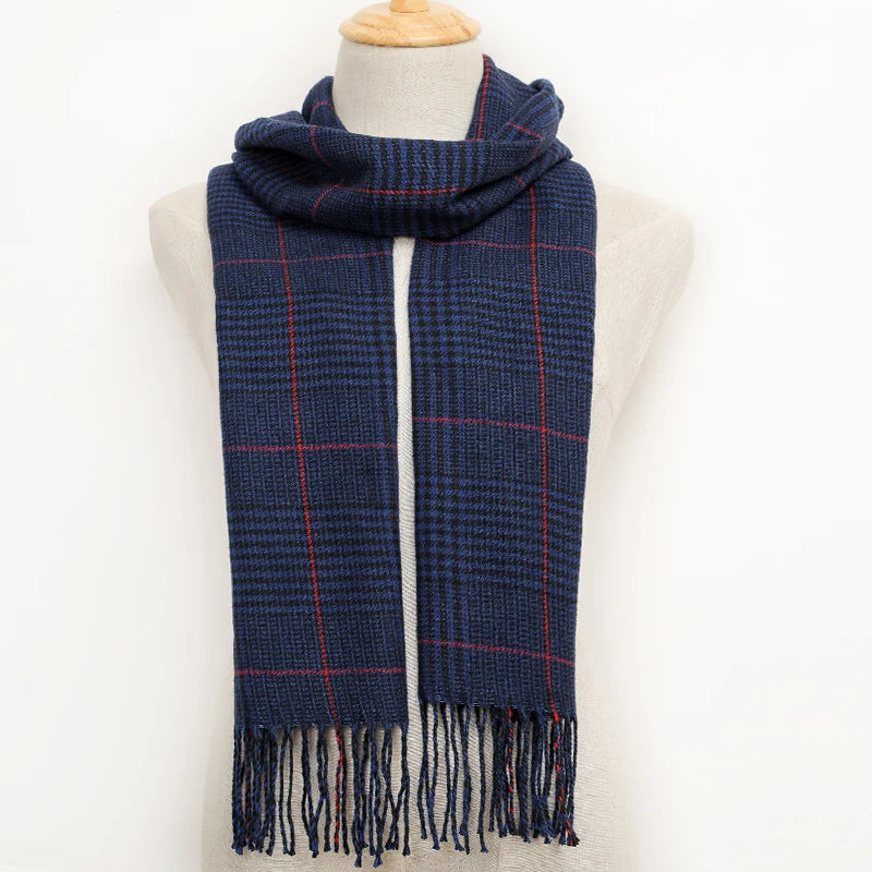 Blue plaid scarf with fringes on a mannequin against a white background