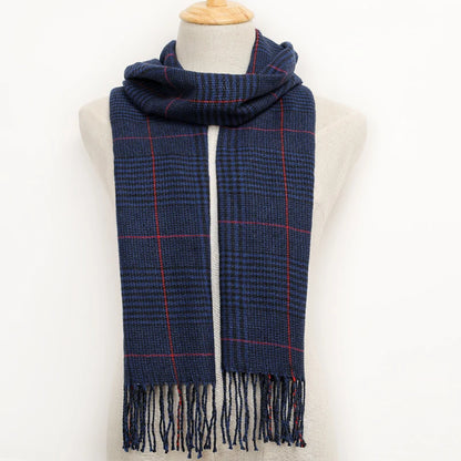 Blue plaid scarf with fringes on a mannequin against a white background