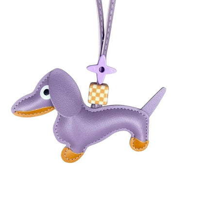 Purple dachshund-shaped keychain with a checkered pattern on a white background
