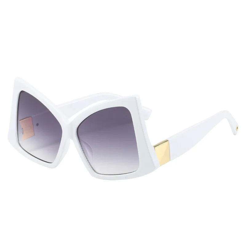 White sunglasses with gold accents on a white background