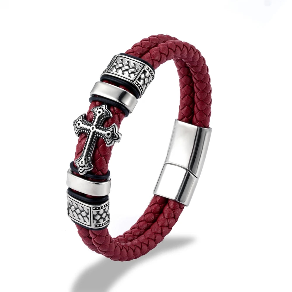 A red braided leather bracelet with silver-tone metal accents, including a central cross charm, textured spacer rings, and a magnetic clasp, shown on a white background.
