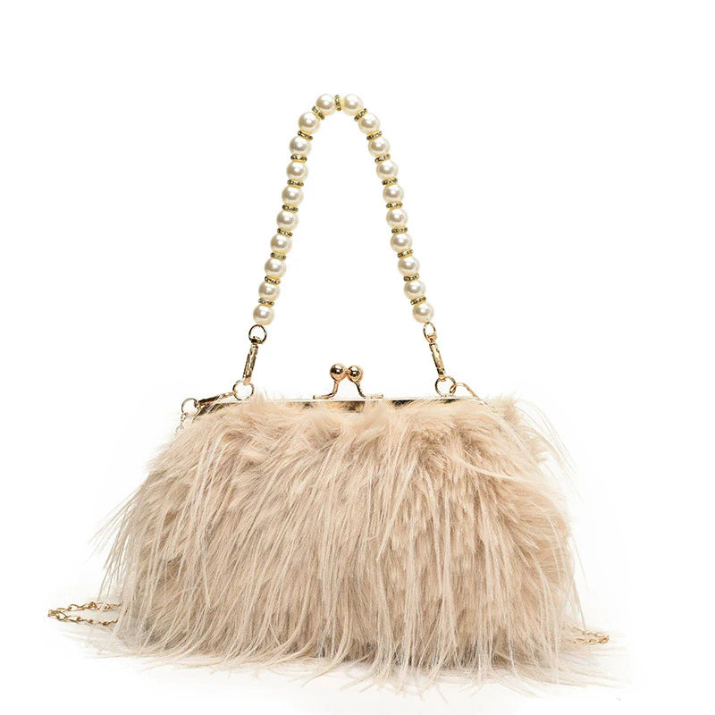 Beige fur handbag with pearl handle on a white background