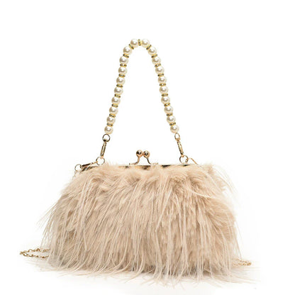 Beige fur handbag with pearl handle on a white background