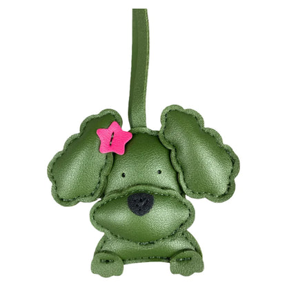Green leather dog-shaped charm with a pink star on a white background