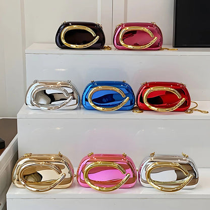 Set of colourful handbags on a white surface with a neutral background