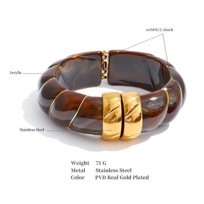 Bracelet with tortoiseshell design and gold accents on a white background