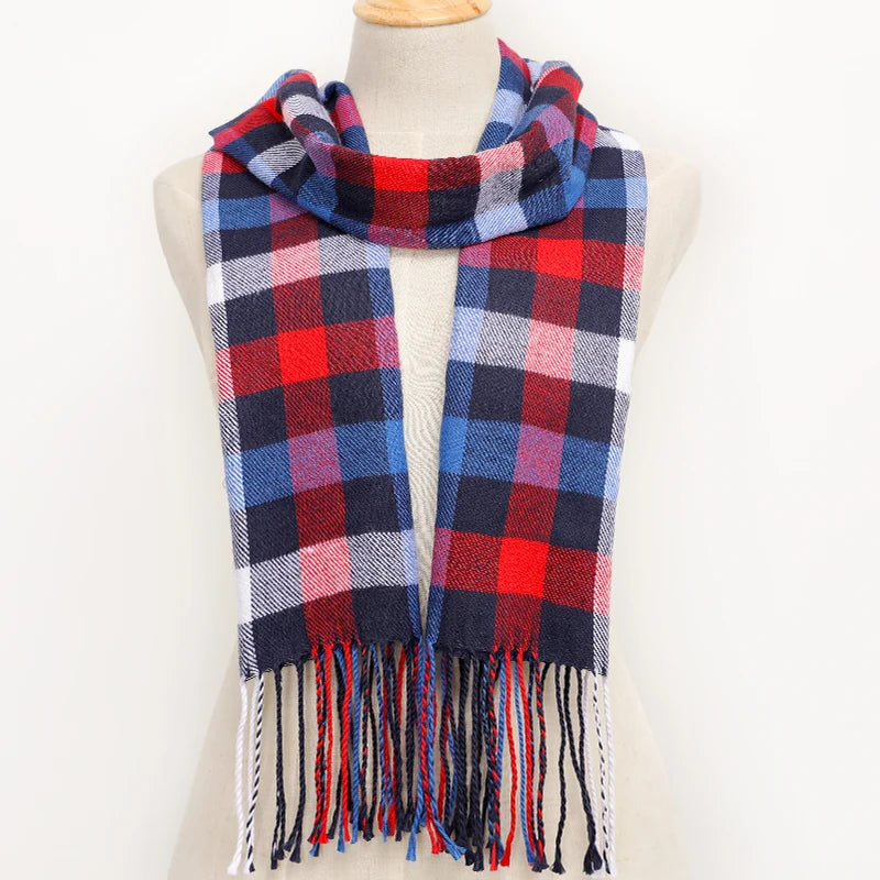 Plaid scarf with fringes on a mannequin against a white background