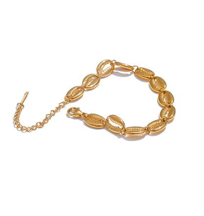 Gold bracelet on a white background
