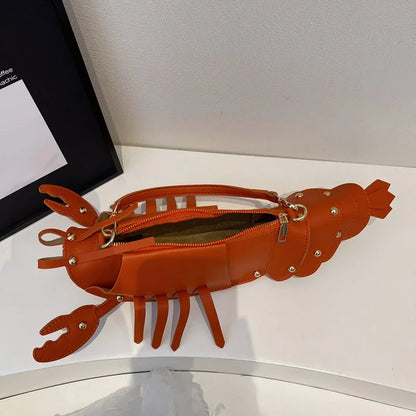 Lobster-shaped handbag on a white background.