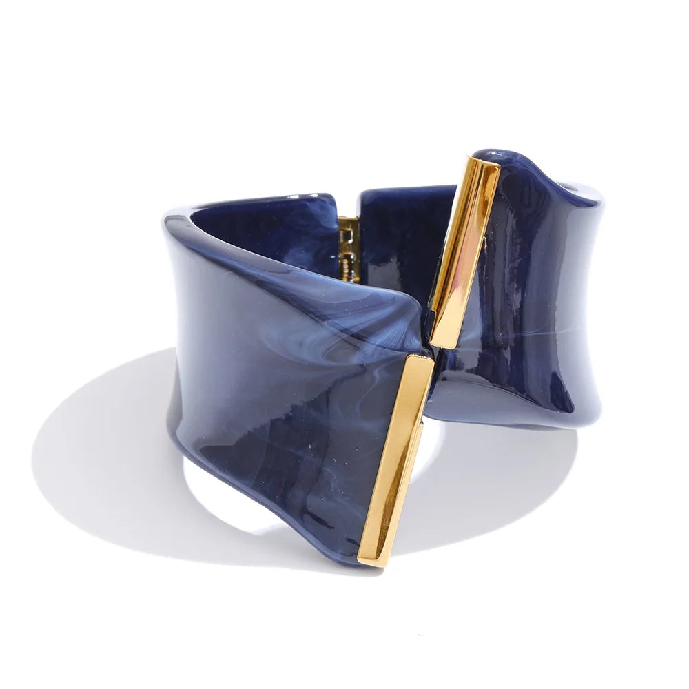 Navy blue and gold bracelet on a white background