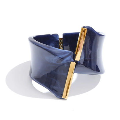 Navy blue and gold bracelet on a white background