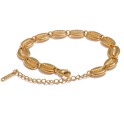 Gold bracelet with a chain link on a white background