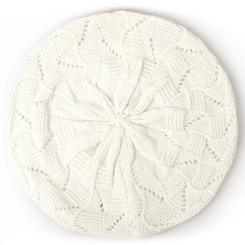 White knit beret on a white background