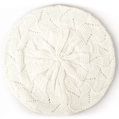 White knit beret on a white background
