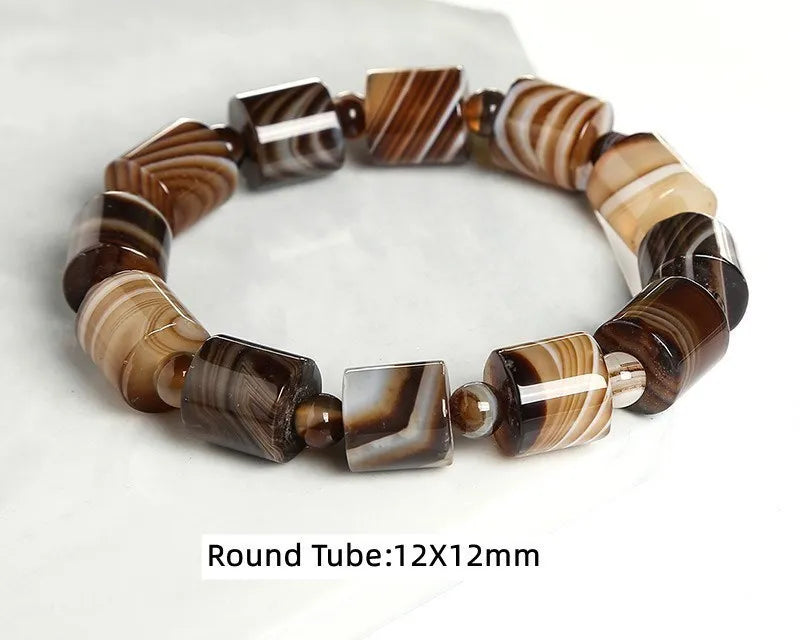 Banded agate bracelet on a white background.