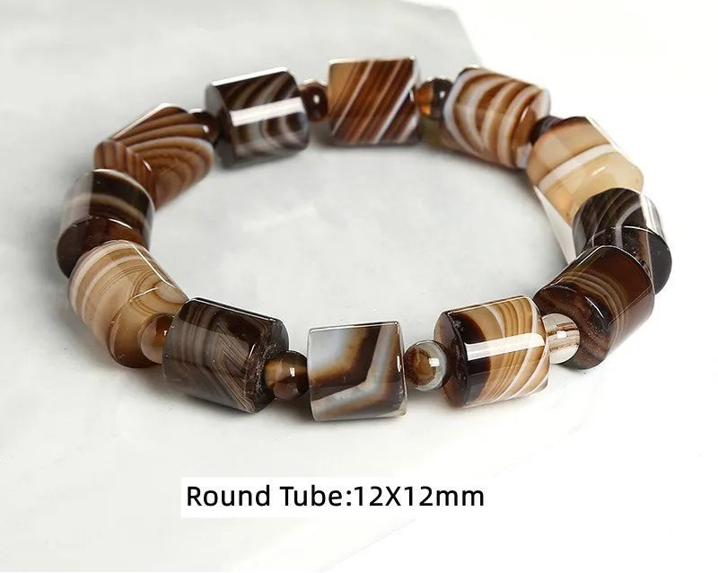 Banded agate bracelet on a white background.