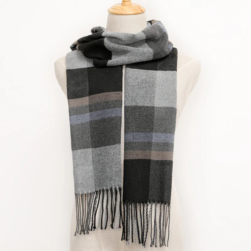 Plaid scarf with black and grey pattern on a mannequin against a white background