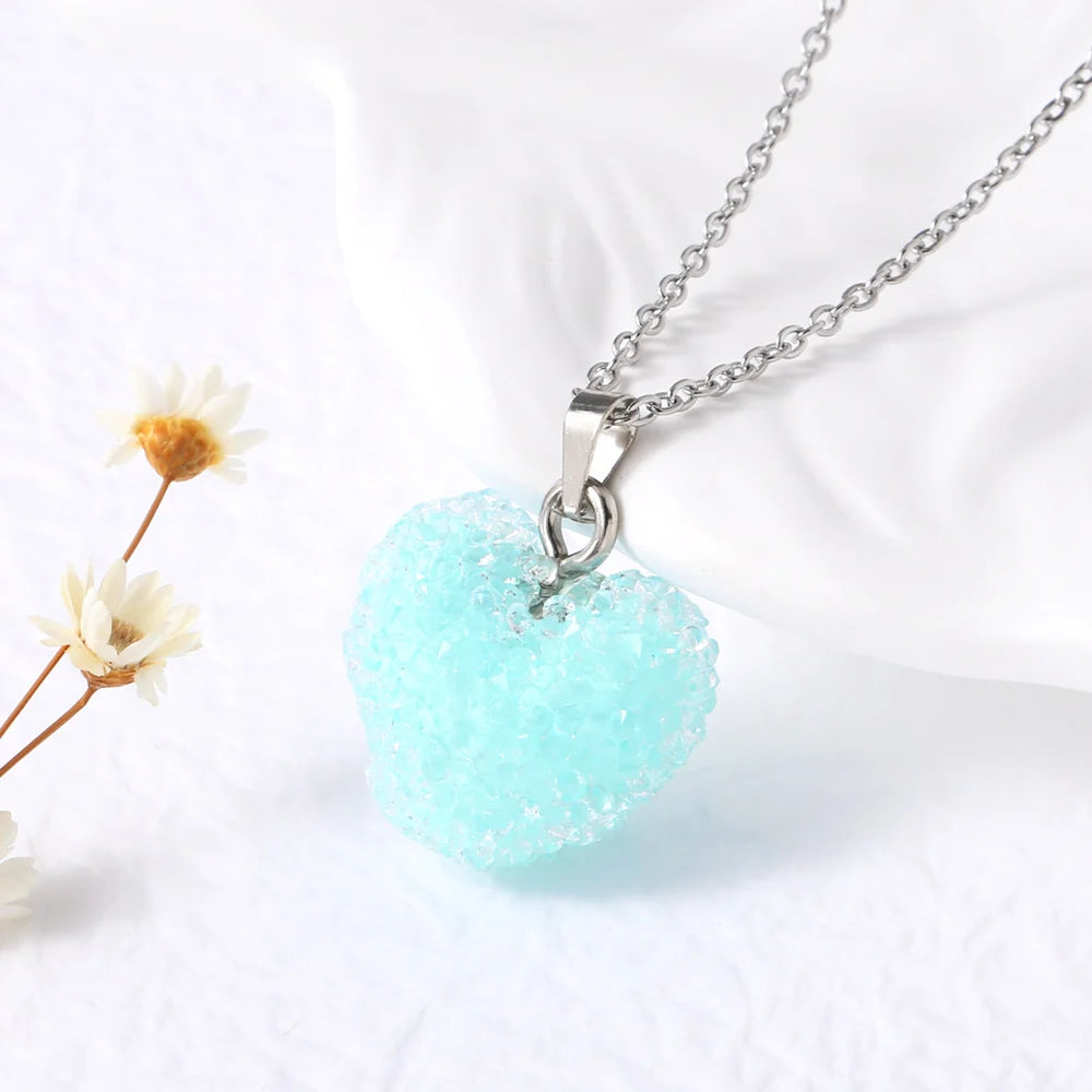 Necklace with a light blue heart-shaped pendant on a white background