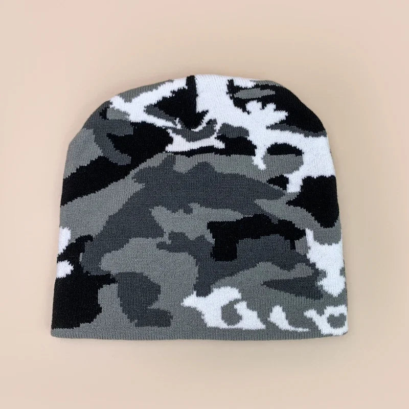 Camouflage-patterned beanie on a beige background