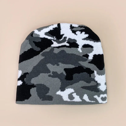 Camouflage-patterned beanie on a beige background