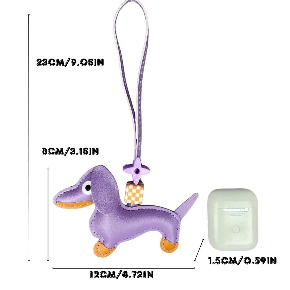 Purple dog-shaped keychain with measurements on a white background