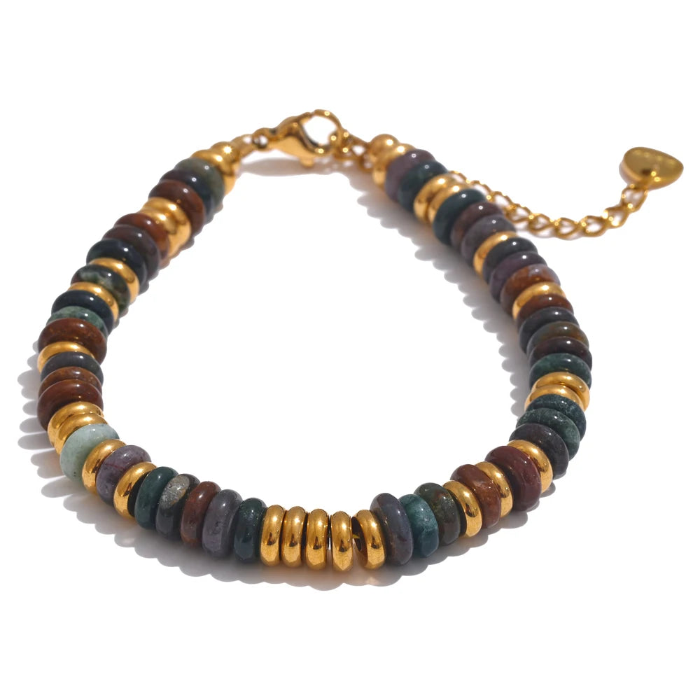 Bracelet with multicoloured beads and gold accents on a white background