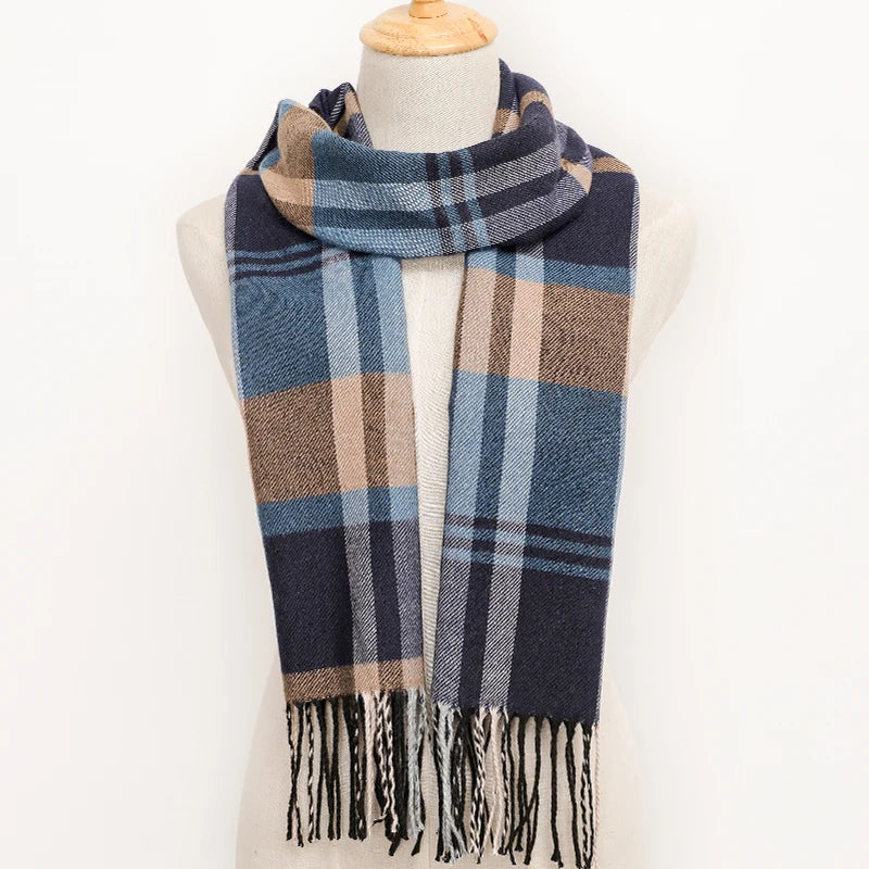 Plaid scarf with fringes on a mannequin against a white background