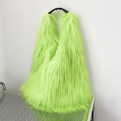 Neon green fur bag on a trolley against a white wall