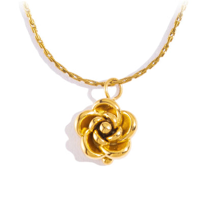 Gold rose necklace on a white background 