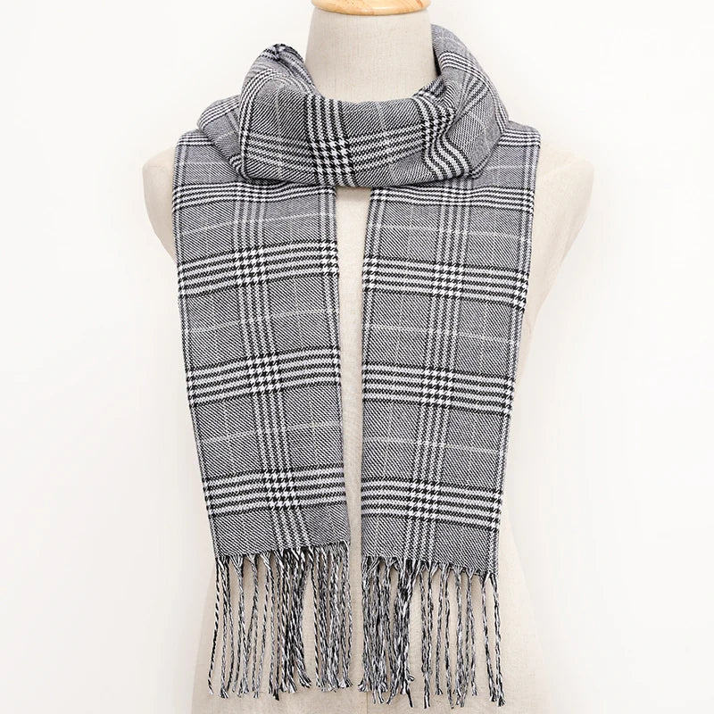 Plaid scarf with fringes on a mannequin against a white background