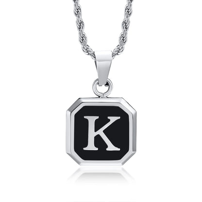 Necklace with a black and silver pendant featuring the letter 'K' on a white background