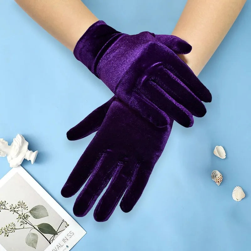 Purple velvet gloves on a light blue background with decorative elements.