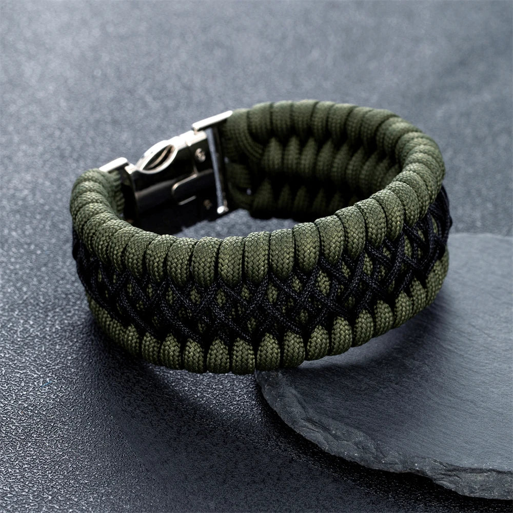 Green braided bracelet on a dark grey surface