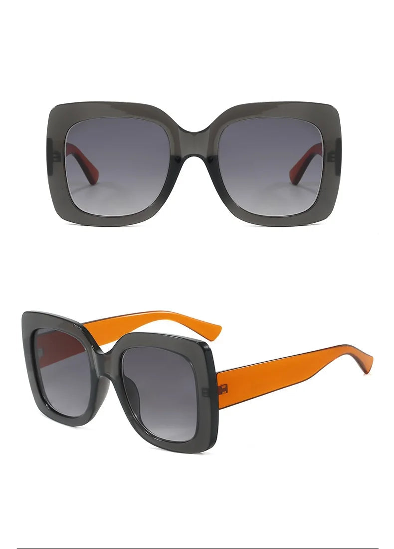 Two views of oversized square sunglasses on a white background. The top view shows dark grey translucent frames with gradient grey lenses and red temple tips.