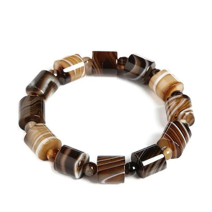 Banded agate bracelet on a white background