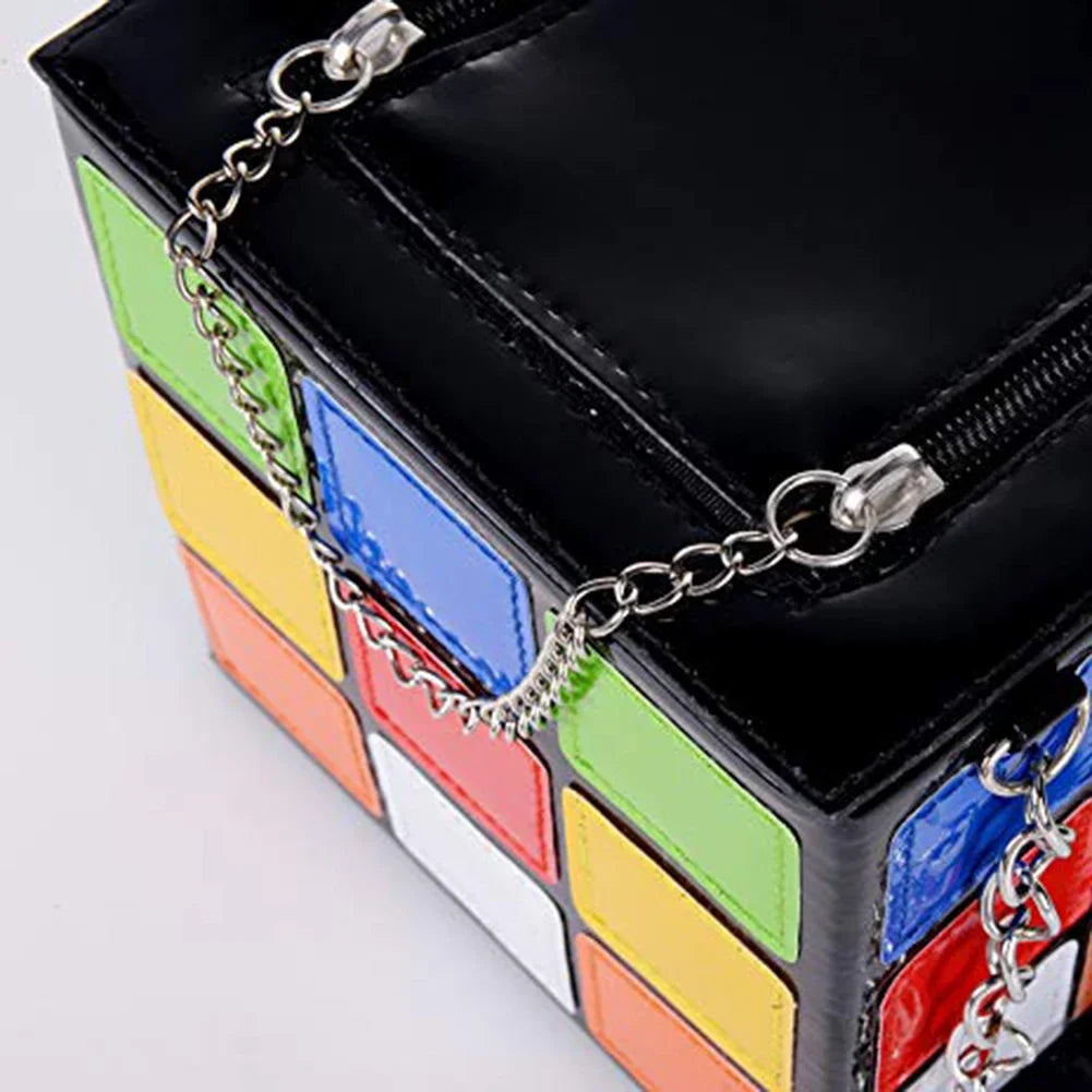 Colourful block-style handbag with a chain detail on a light gray background