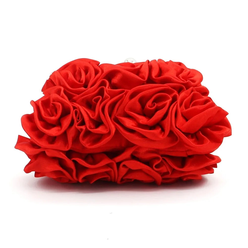 Red rose-shaped clutch bag on a white background