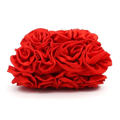 Red rose-shaped clutch bag on a white background