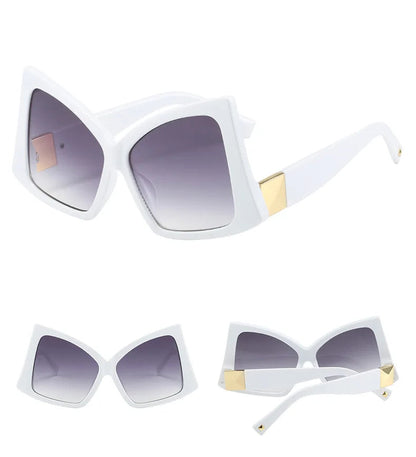 White oversized square sunglasses with gradient grey lenses and gold metal accents on the temples.