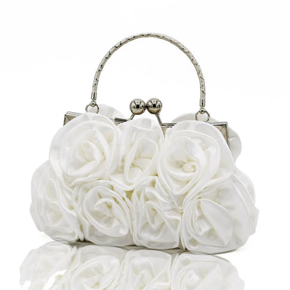 White floral clutch bag with silver frame on a white background
