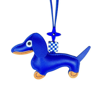 Blue dachshund-shaped keychain with a checkered pattern on a white background