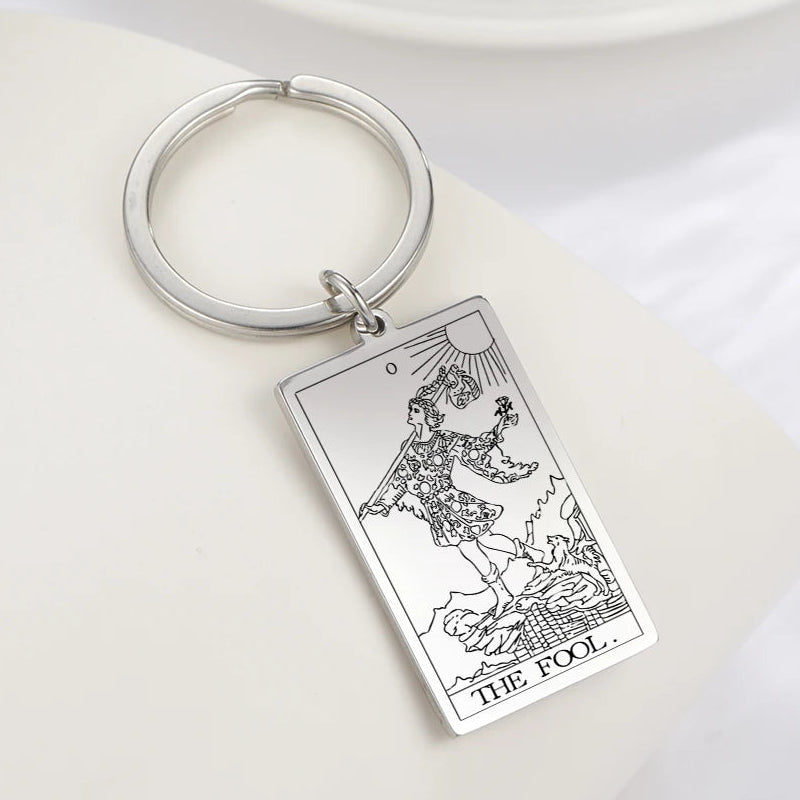 Keychain with Tarot card design on a white surface