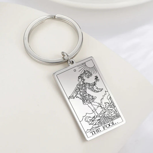 Keychain with Tarot card design on a white surface