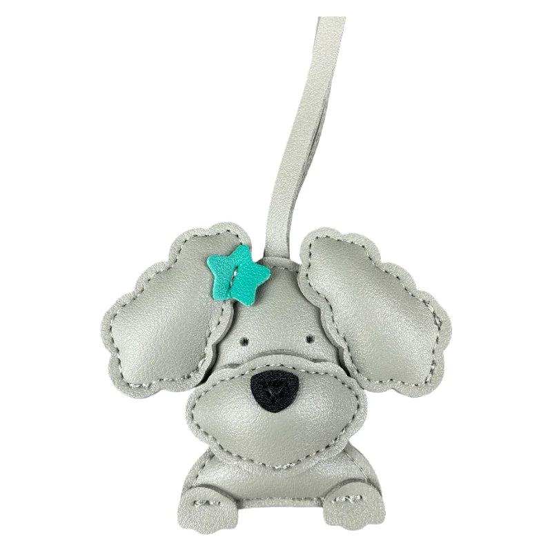 Grey dog-shaped keychain with a turquoise star on a white background