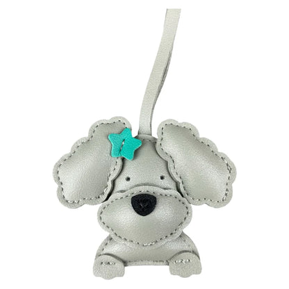 Grey dog-shaped keychain with a turquoise star on a white background