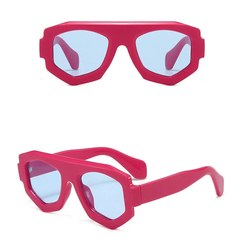 Rose red sunglasses with blue lenses on a white background