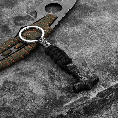 Keychain with paracord and metal keyring on a textured surface
