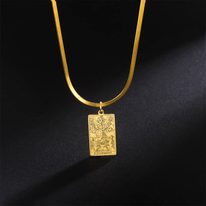 Gold necklace with a rectangular pendant on a black background