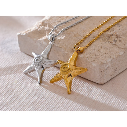 Star-shaped pendants on chains against a stone background