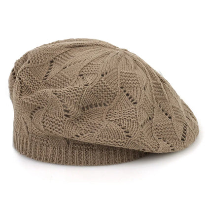 Brown knitted beret on a white background